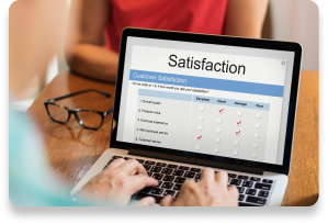 Hands typing on laptop showing customer satisfaction survey