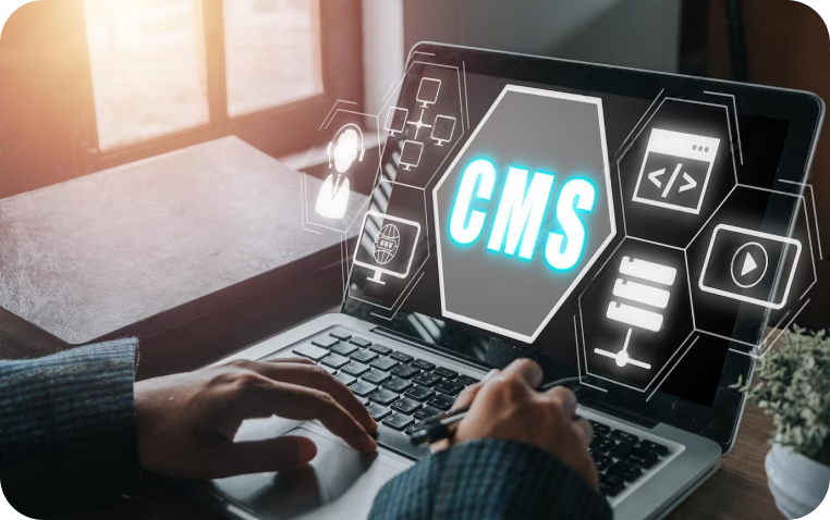 Hands typing on a laptop with holographic CMS icons and elements, representing content management system development.